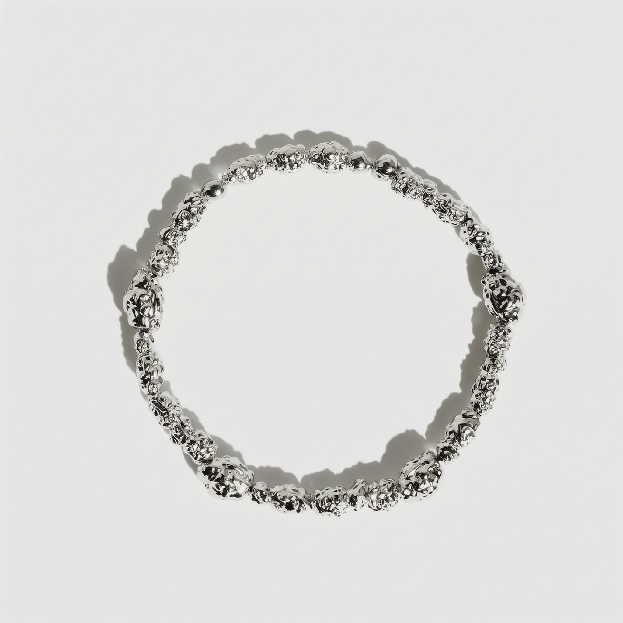 Silver beaded nugget bracelet with 4.5mm beads strung along the length, shown on a plain background.