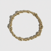 14k gold plated beaded nugget bracelet with 4.5mm beads strung along the length, shown on a plain background.