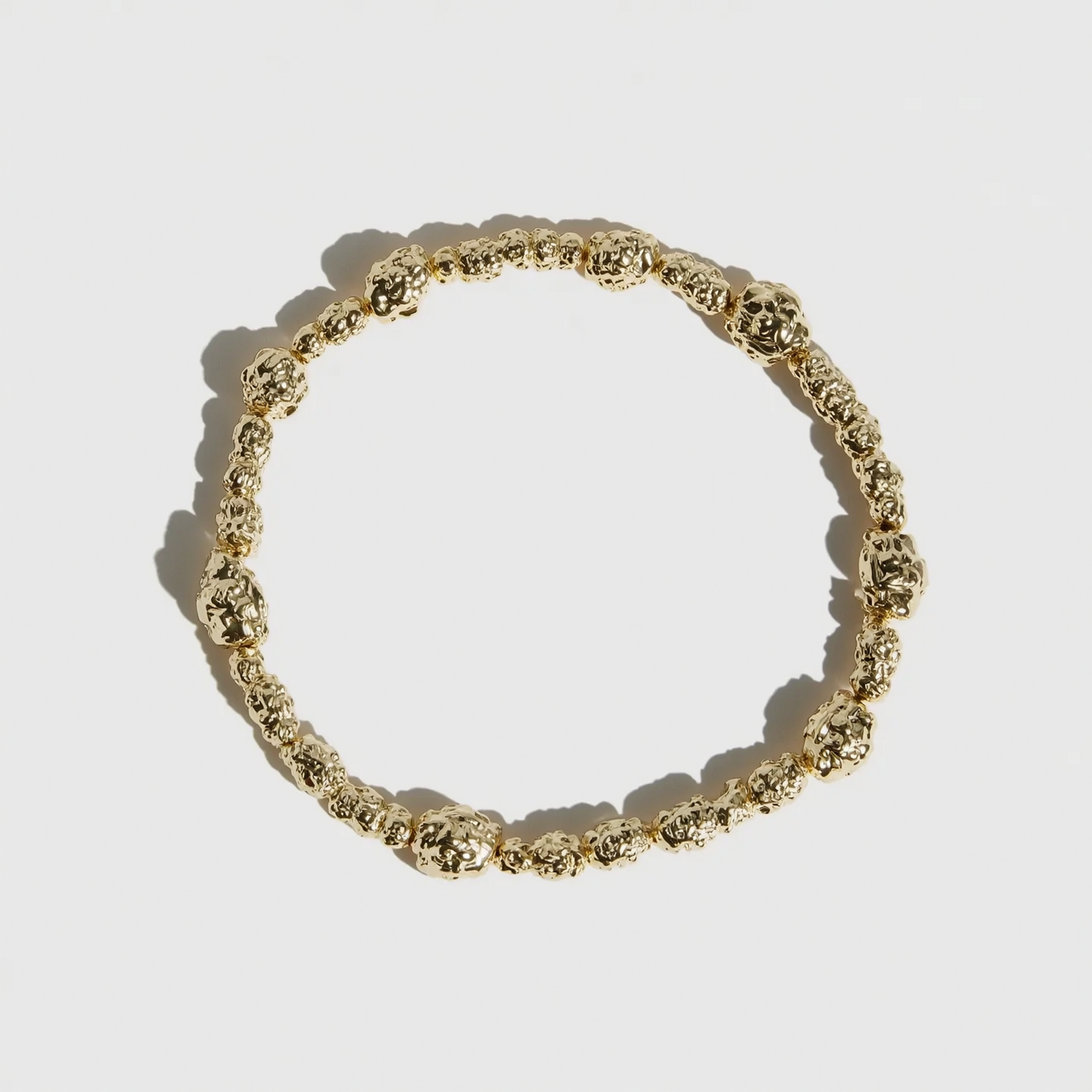 14k gold plated beaded nugget bracelet with 4.5mm beads strung along the length, shown on a plain background.