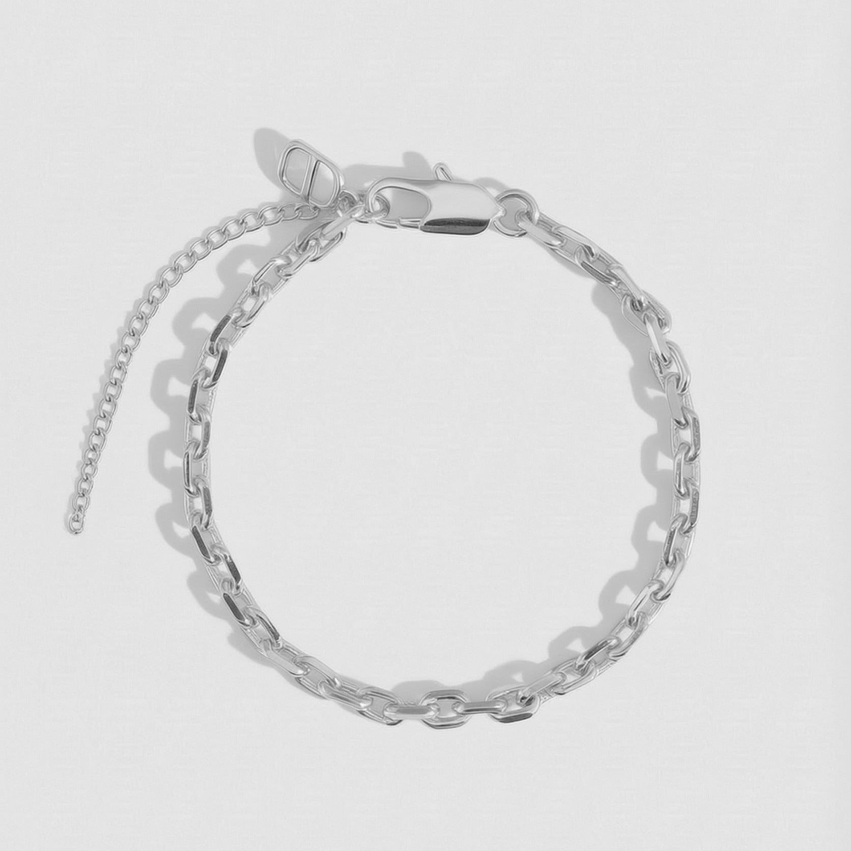 Silver squoval link chain anklet, shown on a plain background.