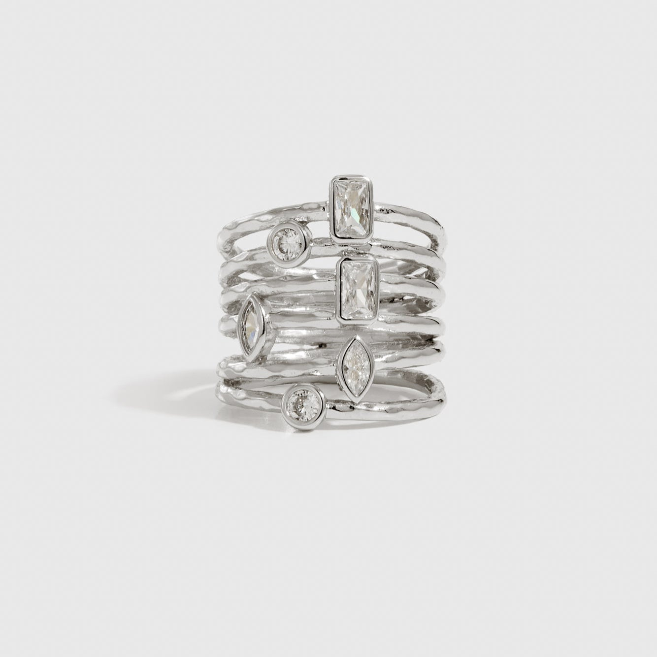 Silver plated raw stacked ring with cubic zirconia, shown on a plain background.