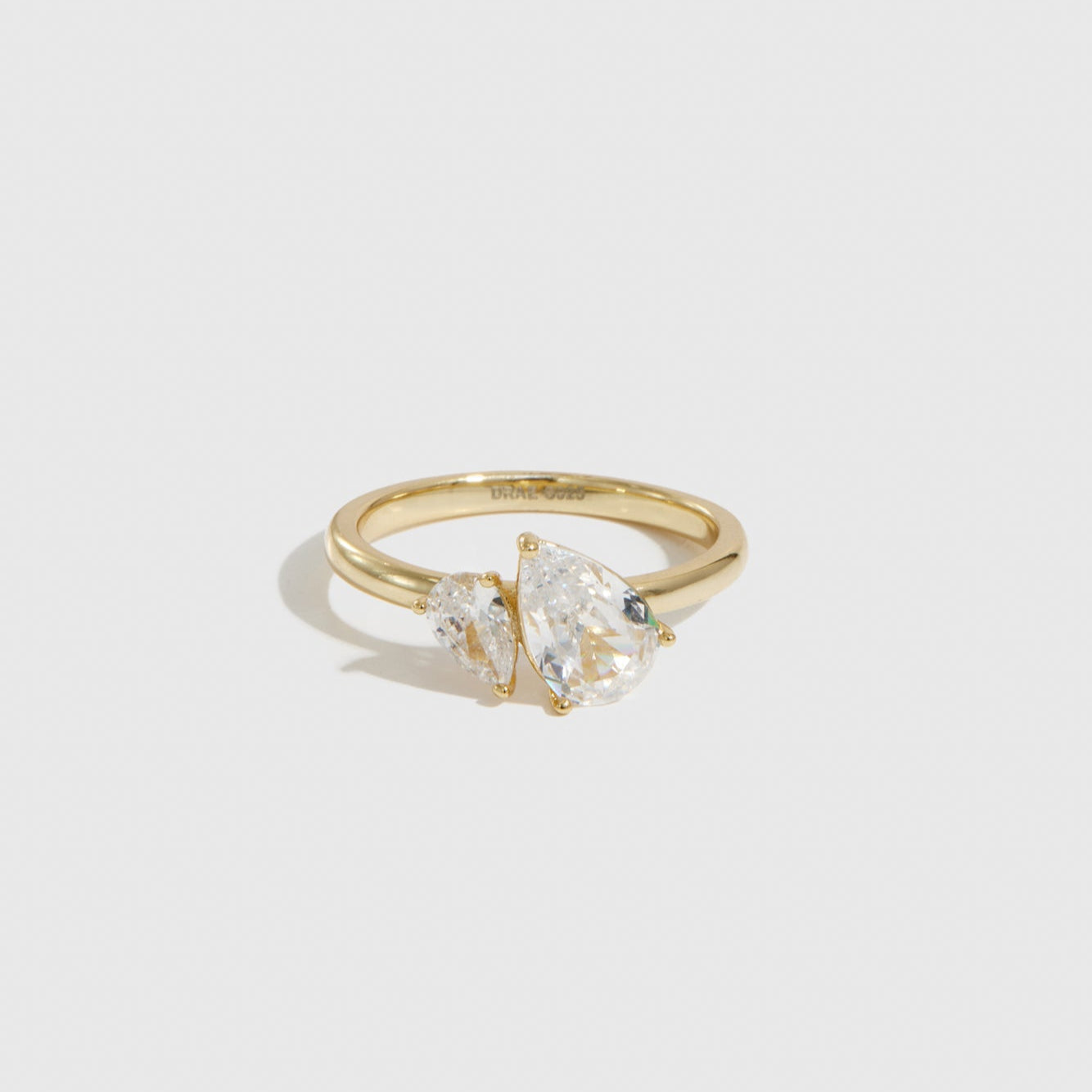 14k gold plated sterling silver 925 double teardrop-cut CZ ring with two teardrop-cut cubic zirconia, shown on a plain background.