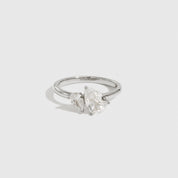 Sterling silver 925 double teardrop-cut CZ ring with two teardrop-cut cubic zirconia, shown on a plain background.