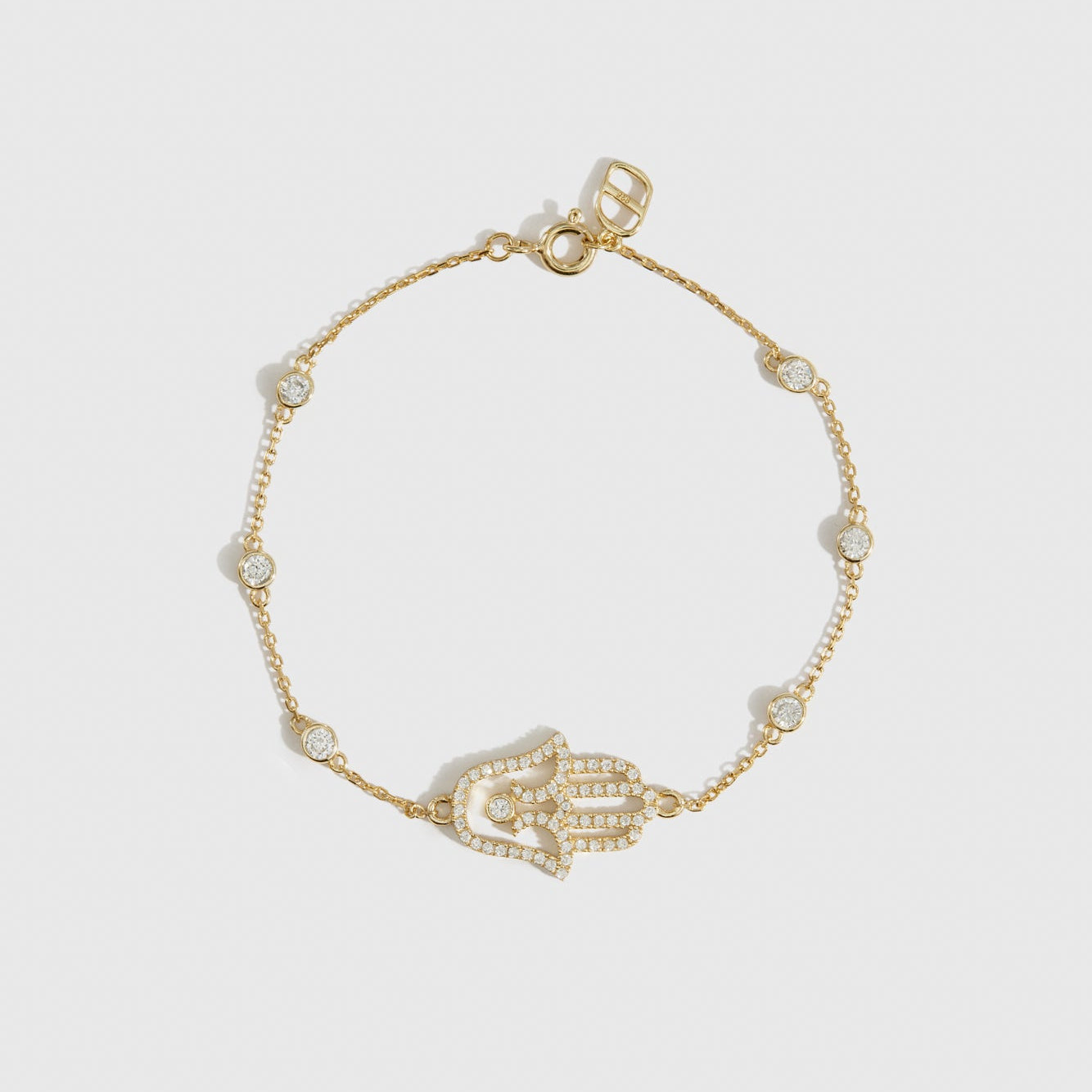 14k gold plated sterling silver 925 hamsa pavé bracelet with cubic zirconia, shown on a plain background.