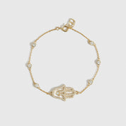 14k gold plated sterling silver 925 hamsa pavé bracelet with cubic zirconia, shown on a plain background.