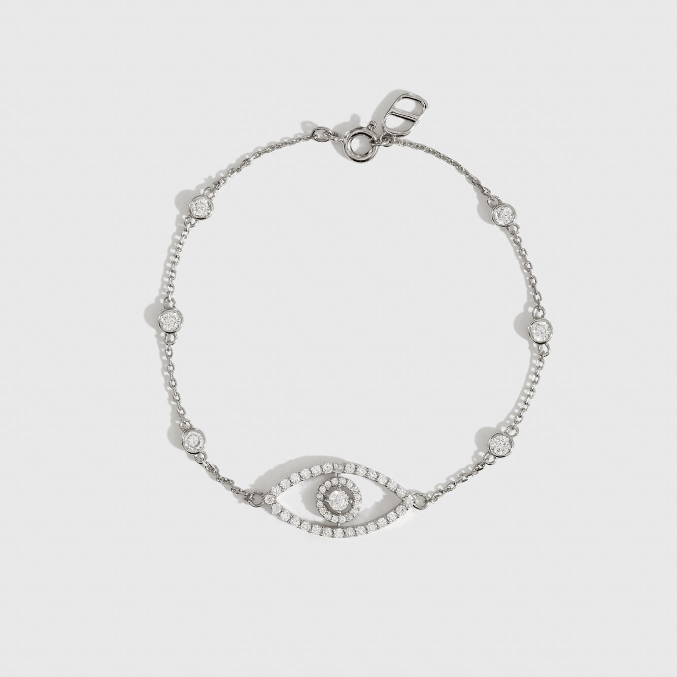 Sterling silver 925 evil eye pavé bracelet with cubic zirconia, shown on a plain background.