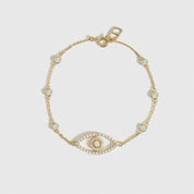 14k gold plated sterling silver 925 evil eye pavé bracelet with cubic zirconia, shown on a plain background.