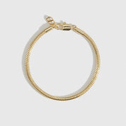 14k gold plated round snake chain bracelet, shown on a plain background.