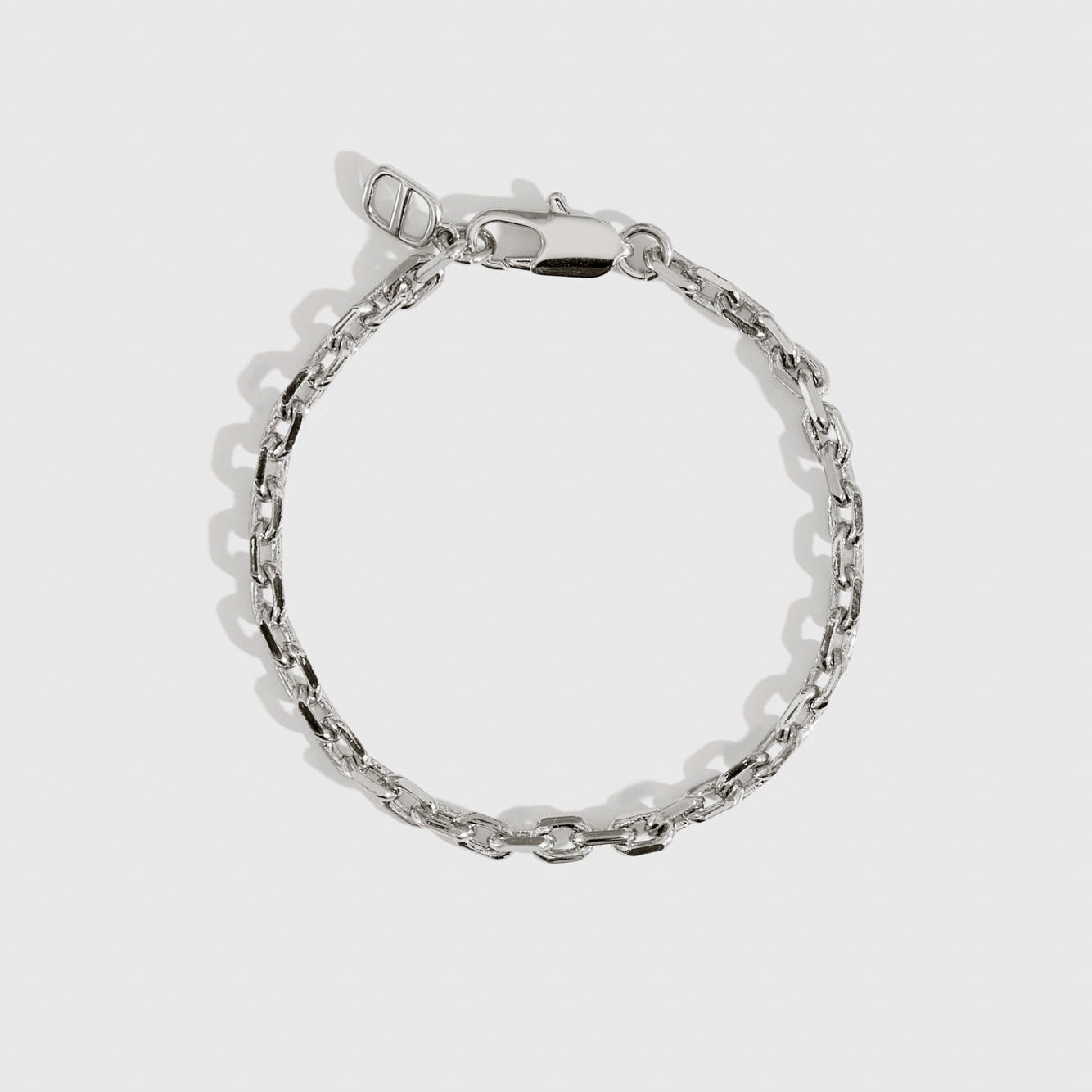 Silver plated squoval chain bracelet, shown on a plain background.