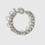 Silver plated small oval link bracelet, shown on a plain background.