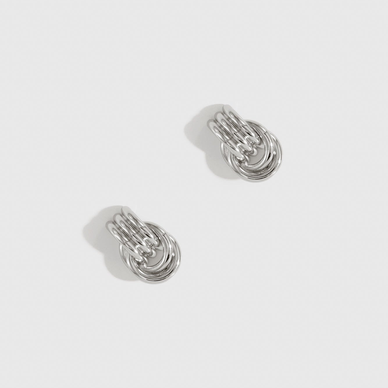 Silver plated mini twist stud earrings, shown on a plain background.