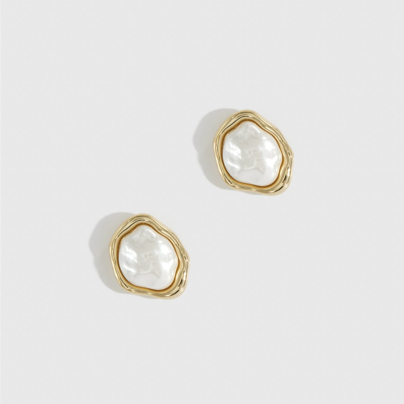 14k gold plated baroque pearl stud earrings with a baroque glass pearl, shown on a plain background.