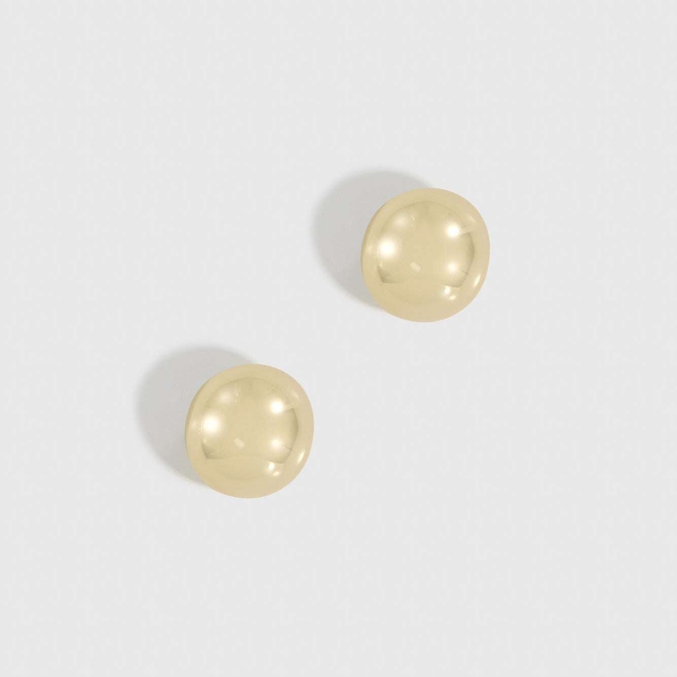 14k gold plated mini puffy dome stud earrings, shown on a plain background.