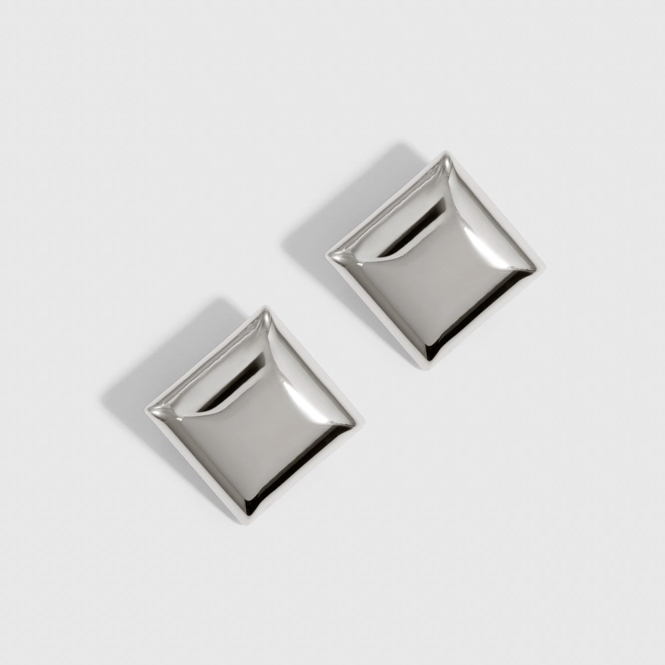 Silver plated square stud earrings, shown on a plain background.
