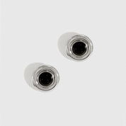 Silver plated black vintage stud earrings with black enamel, shown on a plain background.