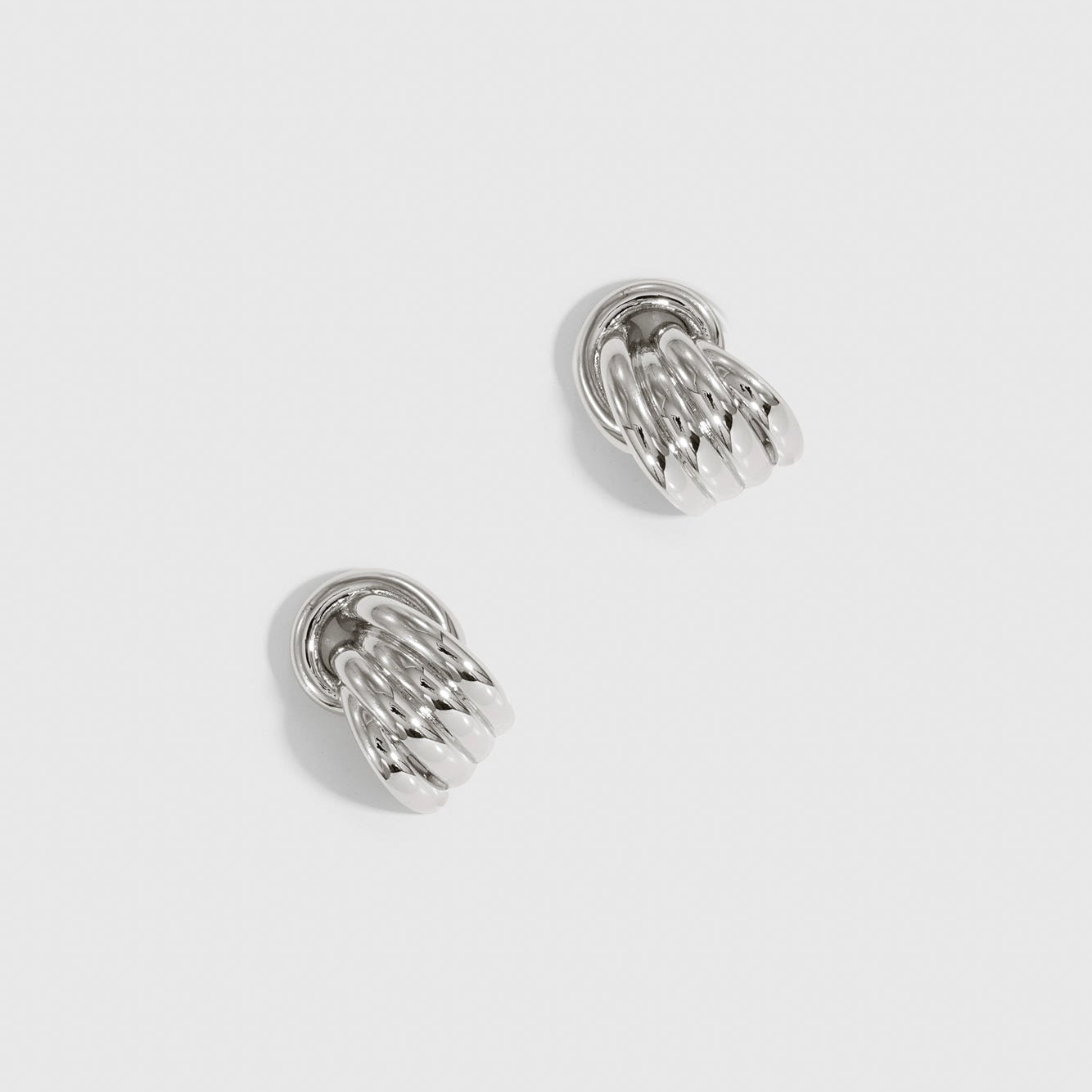 Silver plated mini stud earrings, shown on a plain background.