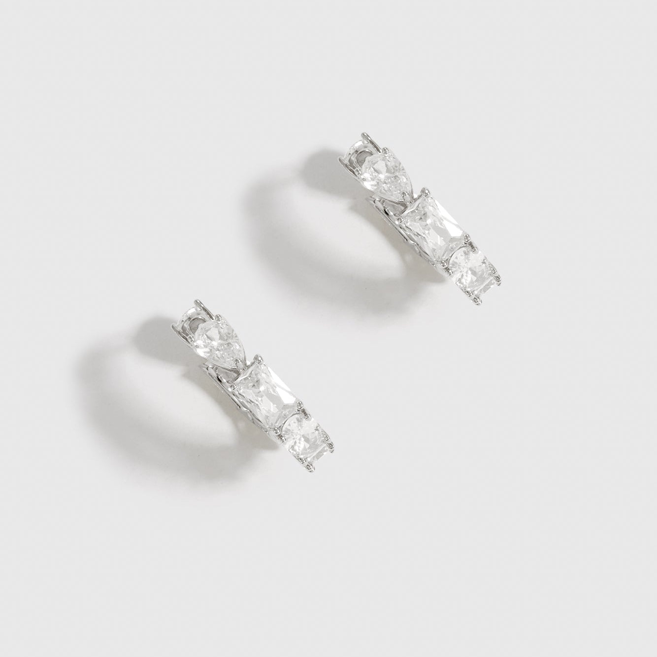 Silver Ophélie mini hoop earrings with mixed cubic zirconia cut styles, shown on a plain background.
