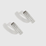 Sterling silver 925 triple row pavé huggies with cubic zirconia, shown on a plain background.