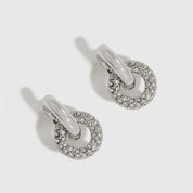 Silver plated crystal pavé convertible huggies with cubic zirconia crystals, shown on a plain background.