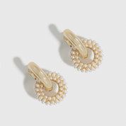 14k gold plated pearl pavé convertible huggies with pearls, shown on a plain background.