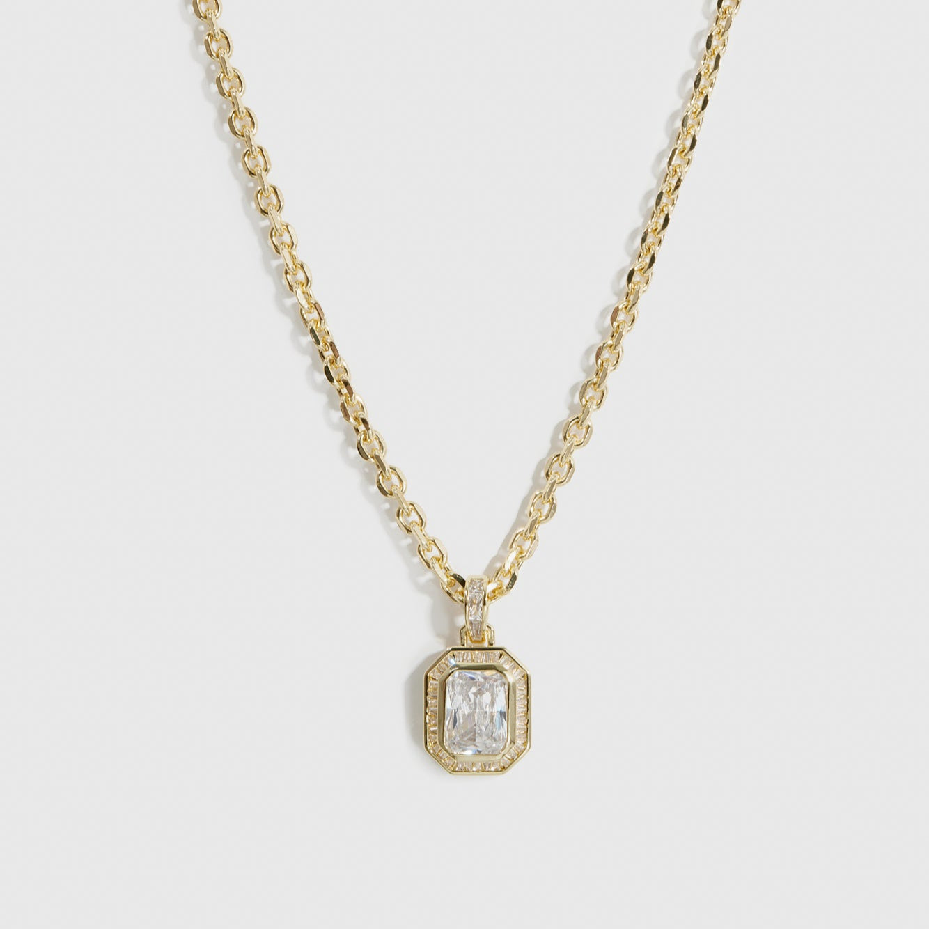 14k gold plated baguette pavé pendant necklace with cubic zirconia, shown on a plain background.