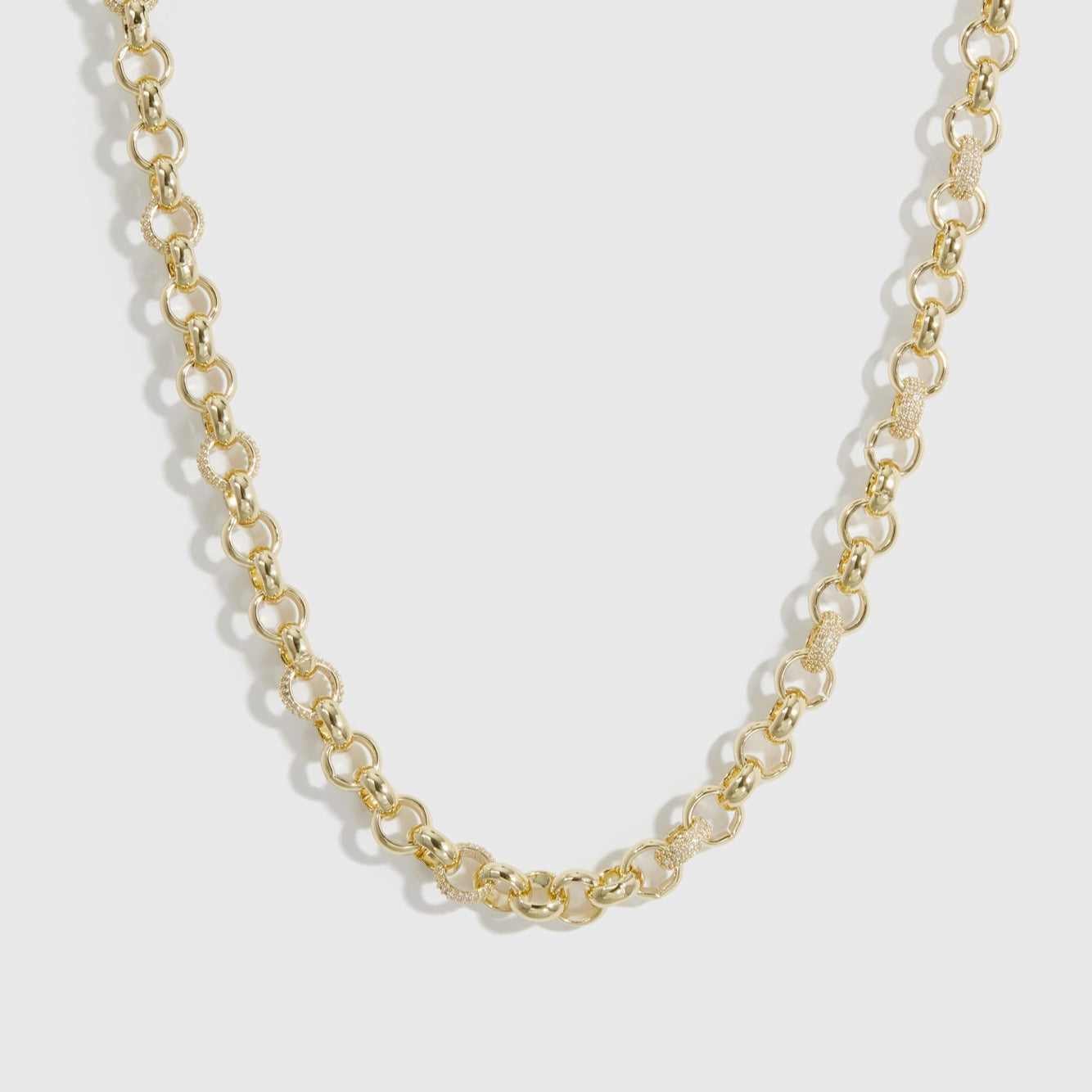 14k gold plated maximalist rolo pavé necklace with pavé cubic zirconia, shown on a plain background.