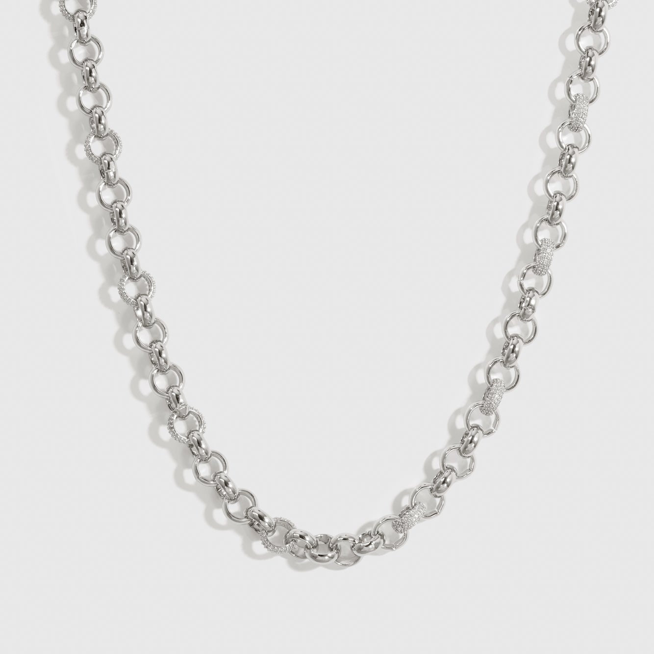 Silver plated maximalist rolo pavé necklace with pavé cubic zirconia, shown on a plain background.