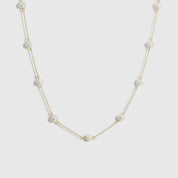 14k gold plated sterling silver 925 pearls by the yard necklace with freshwater pearls, shown on a plain background.