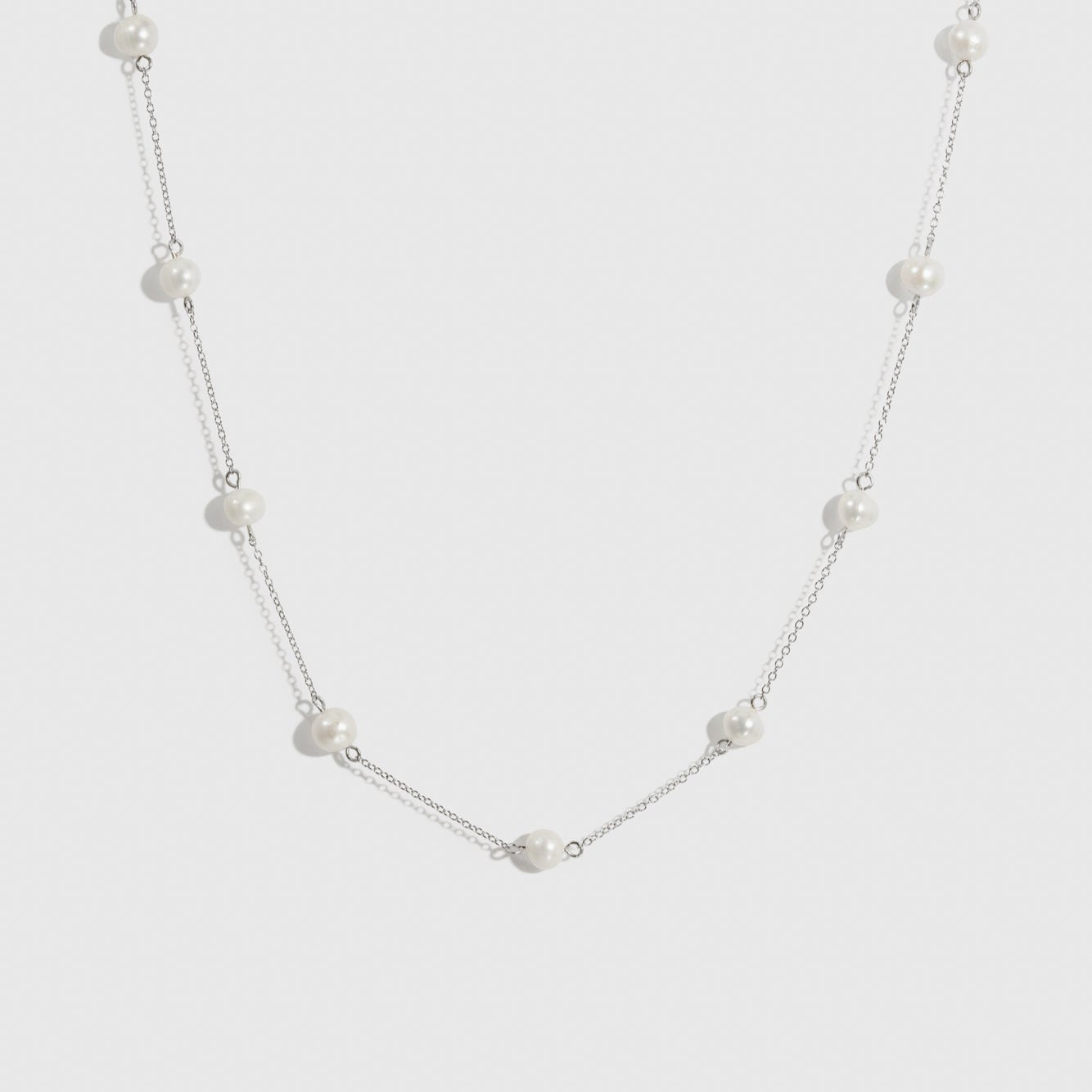 Sterling silver 925 pearls by the yard necklace with freshwater pearls, shown on a plain background.