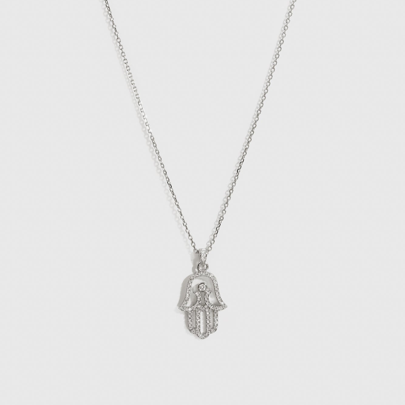 Sterling silver 925 hamsa pavé pendant necklace with cubic zirconia, shown on a plain background.