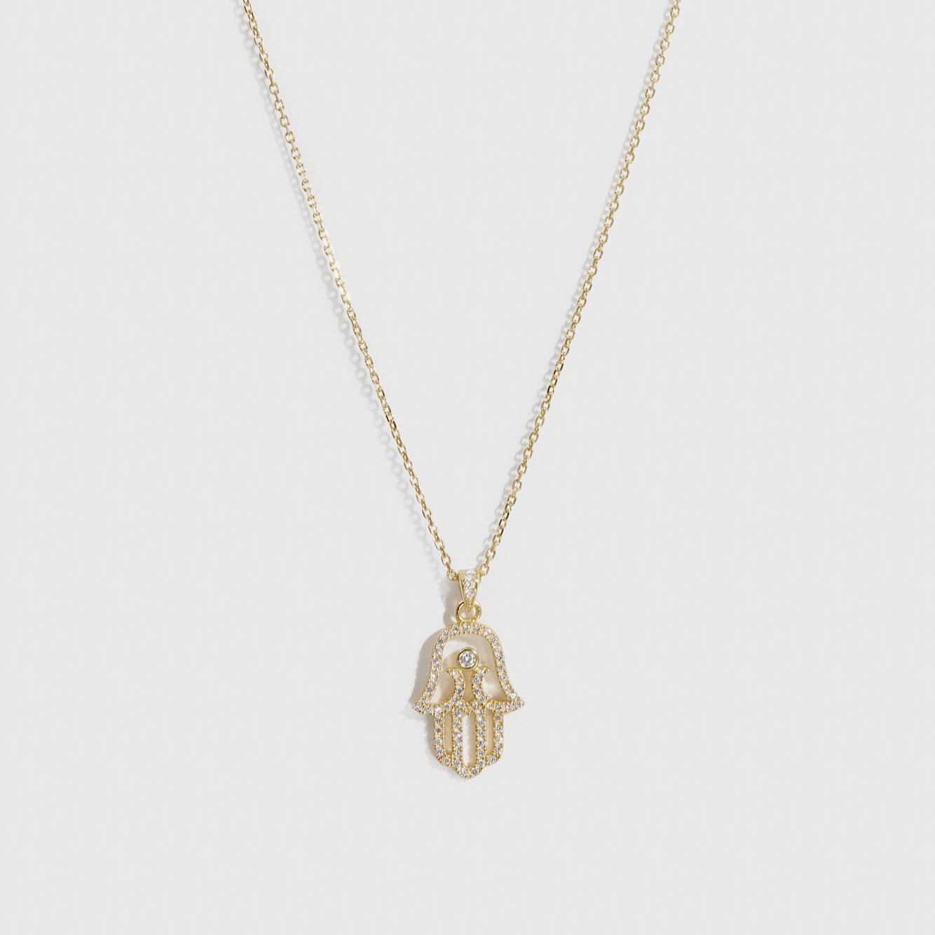 14k gold plated sterling silver 925 hamsa pavé pendant necklace with cubic zirconia, shown on a plain background.