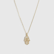 14k gold plated sterling silver 925 hamsa pavé pendant necklace with cubic zirconia, shown on a plain background.