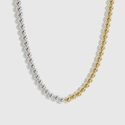 Mixed metal beaded necklace, shown on a plain background.