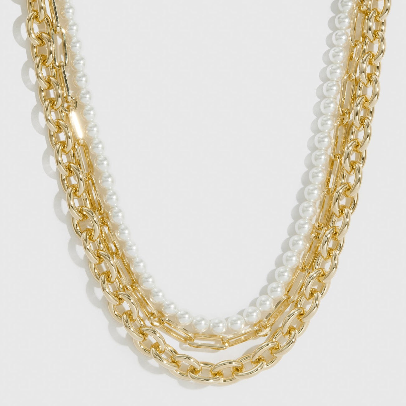 14k gold plated Nova necklace with pearls, shown on a plain background.