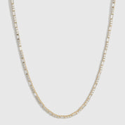 14k gold plated Amina tennis necklace with round and baguette cubic zirconia, shown on a plain background.