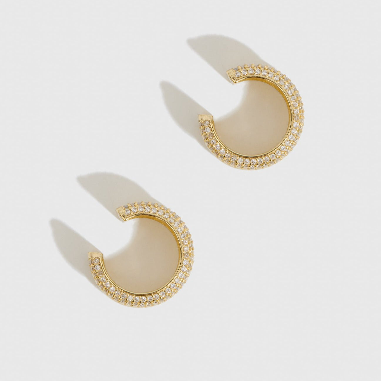 14k gold plated sterling silver 925 Champagne earring cuff with cubic zirconia, shown on a plain background.