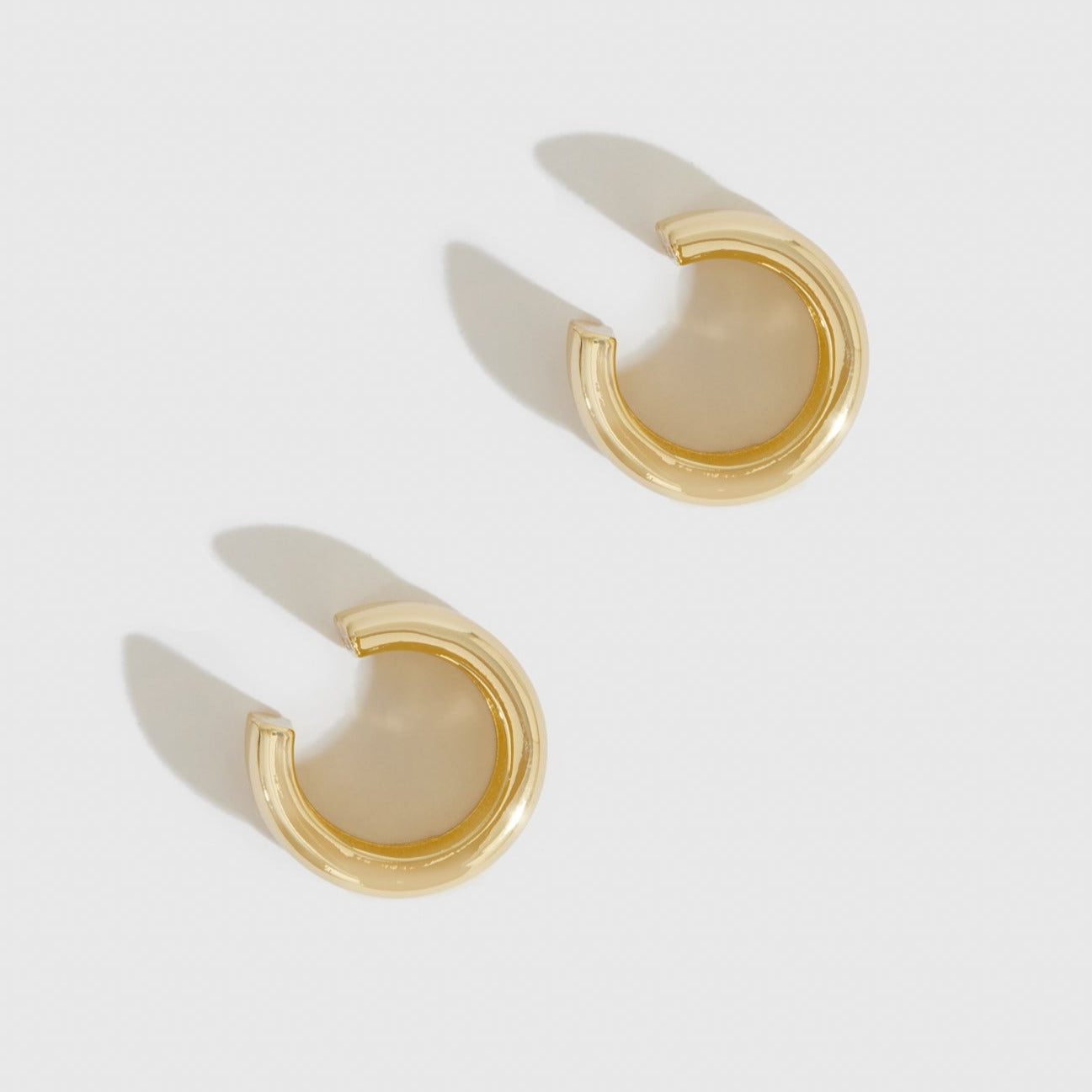 14k gold plated sterling silver 925 sparkless earring cuff, shown on a plain background.