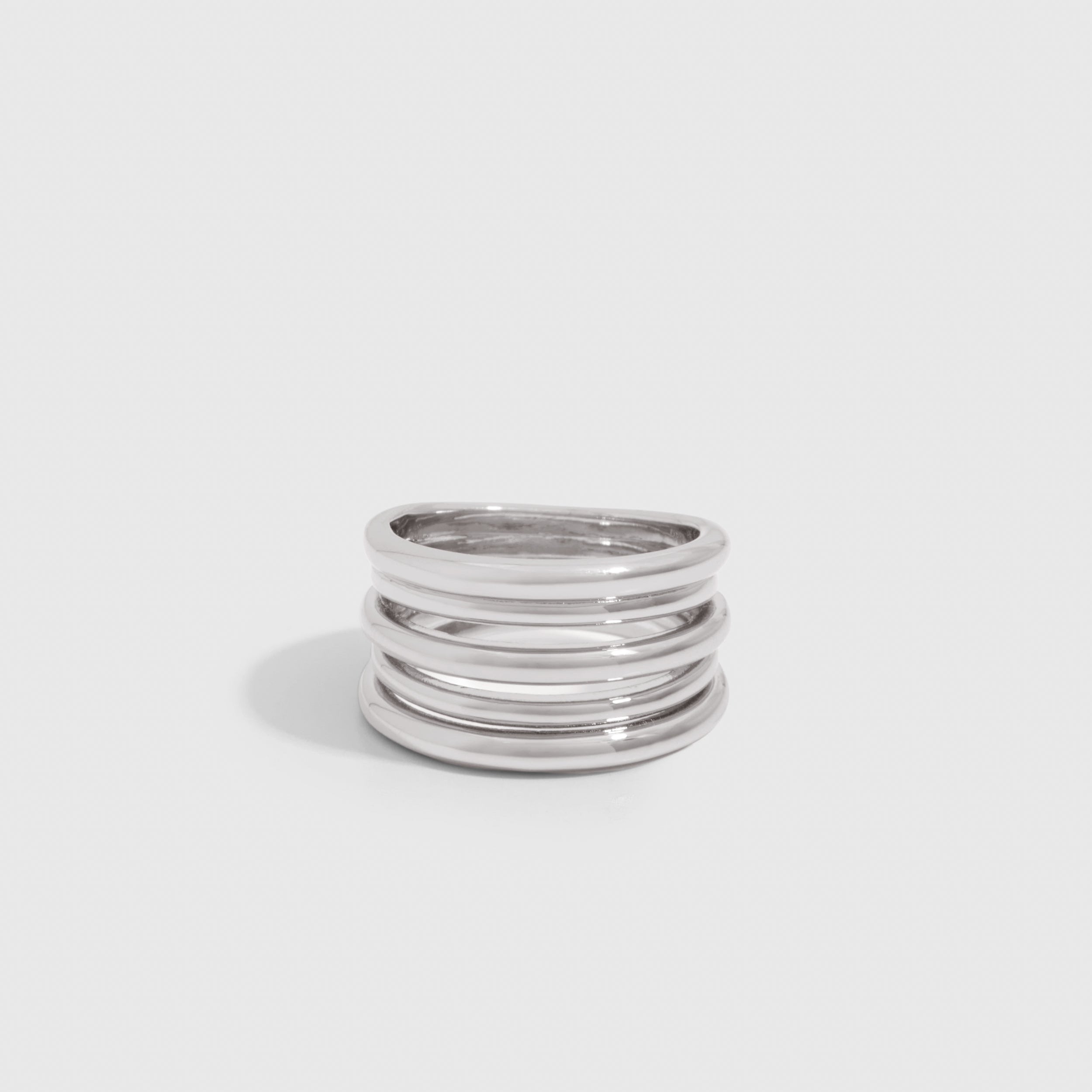 Silver-finished Band Stacked Ring showing five fused bands at varying heights, shown on a plain background.