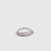 Silver wavy pavé ring with round-cut cubic zirconia set edge to edge, shown on a plain background.