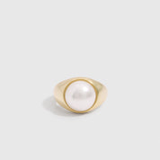 14k gold plated dome ring with a half freshwater pearl set proud of the band, shown on a plain background.