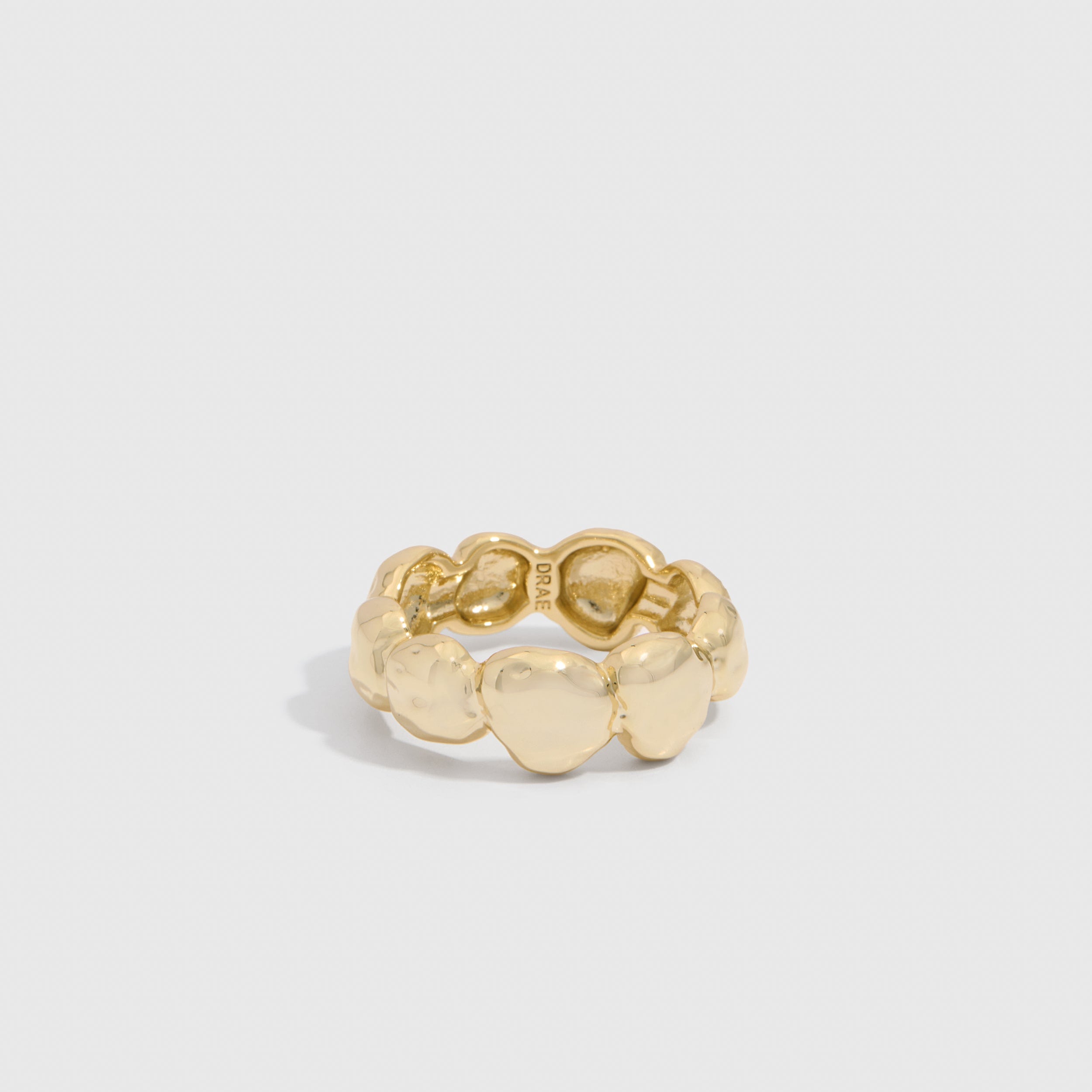 14k gold plated organic nugget ring showing textured beads and flat disc details, shown on a plain background.