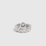 Silver nugget ring with cubic zirconia set among textured beads, shown on a plain background.