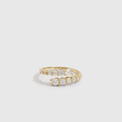 14k gold plated graduated cubic zirconia wrap ring with four stone sizes tapering across the band, shown on a plain background.