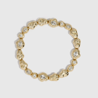 14k gold plated nugget tennis bracelet with cubic zirconia nuggets in two sizes, shown on a plain background.