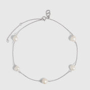 Silver anklet with genuine freshwater pearls strung along a fine chain, shown on a plain background.