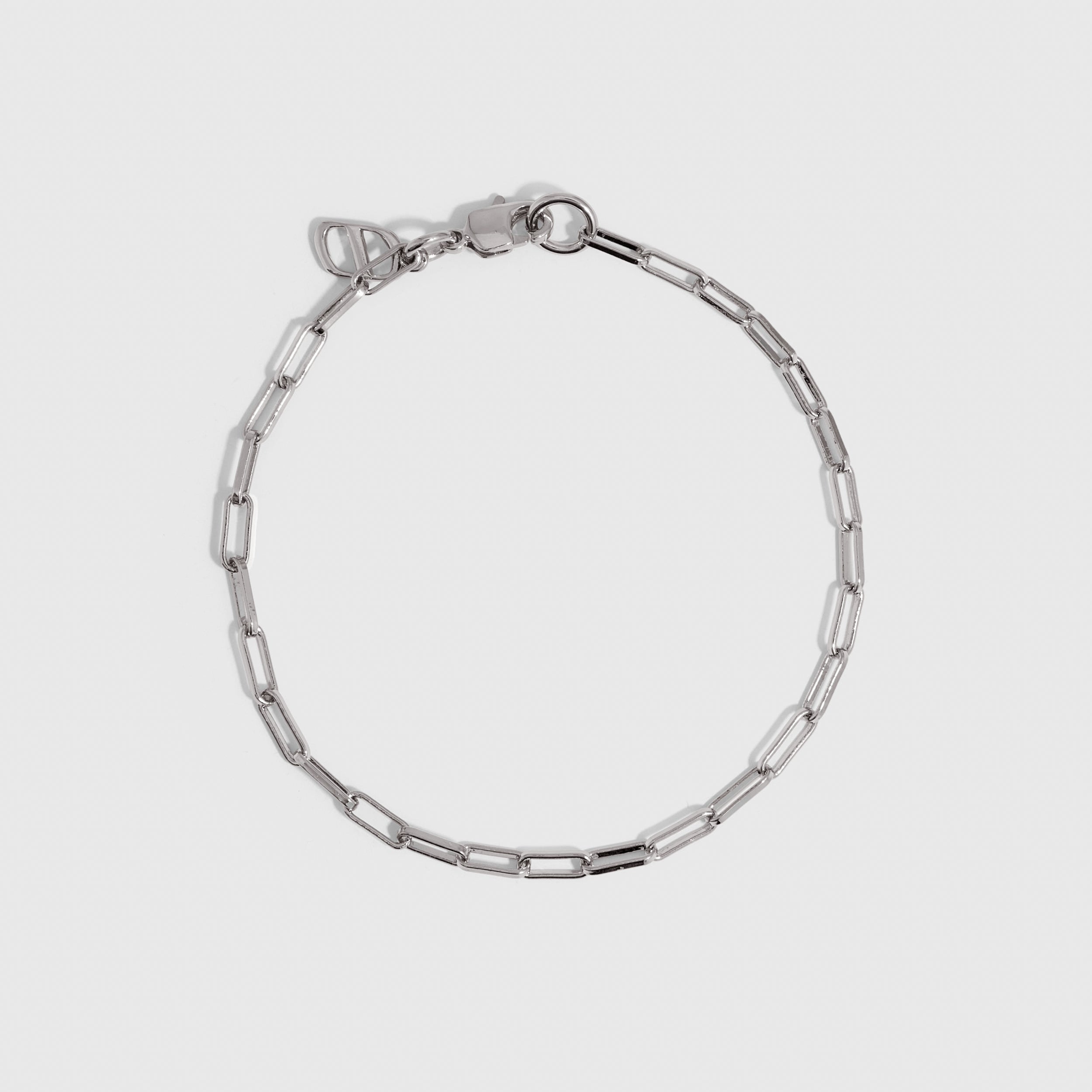 Silver paper clip link chain bracelet, shown on a plain background.