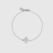 Silver clover motif chain bracelet with cubic zirconia detailing, shown on a plain background.
