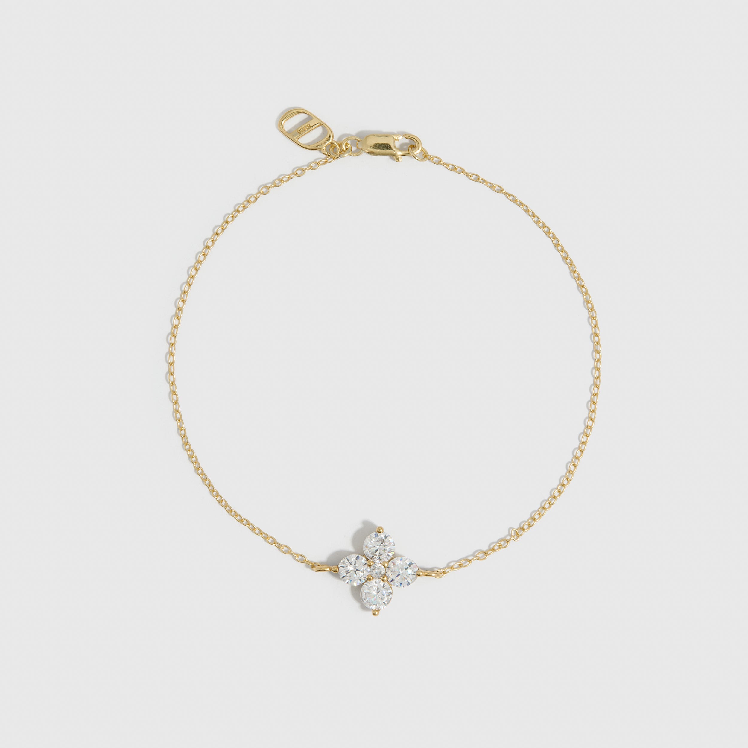 14k gold plated clover motif chain bracelet with cubic zirconia detailing, shown on a plain background.
