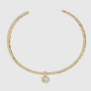 14k gold plated hammered neck cuff necklace with a detachable cubic zirconia charm, shown on a plain background.