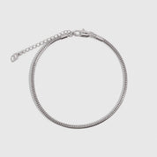 Silver round snake chain anklet with a smooth polished finish, shown on a plain background.